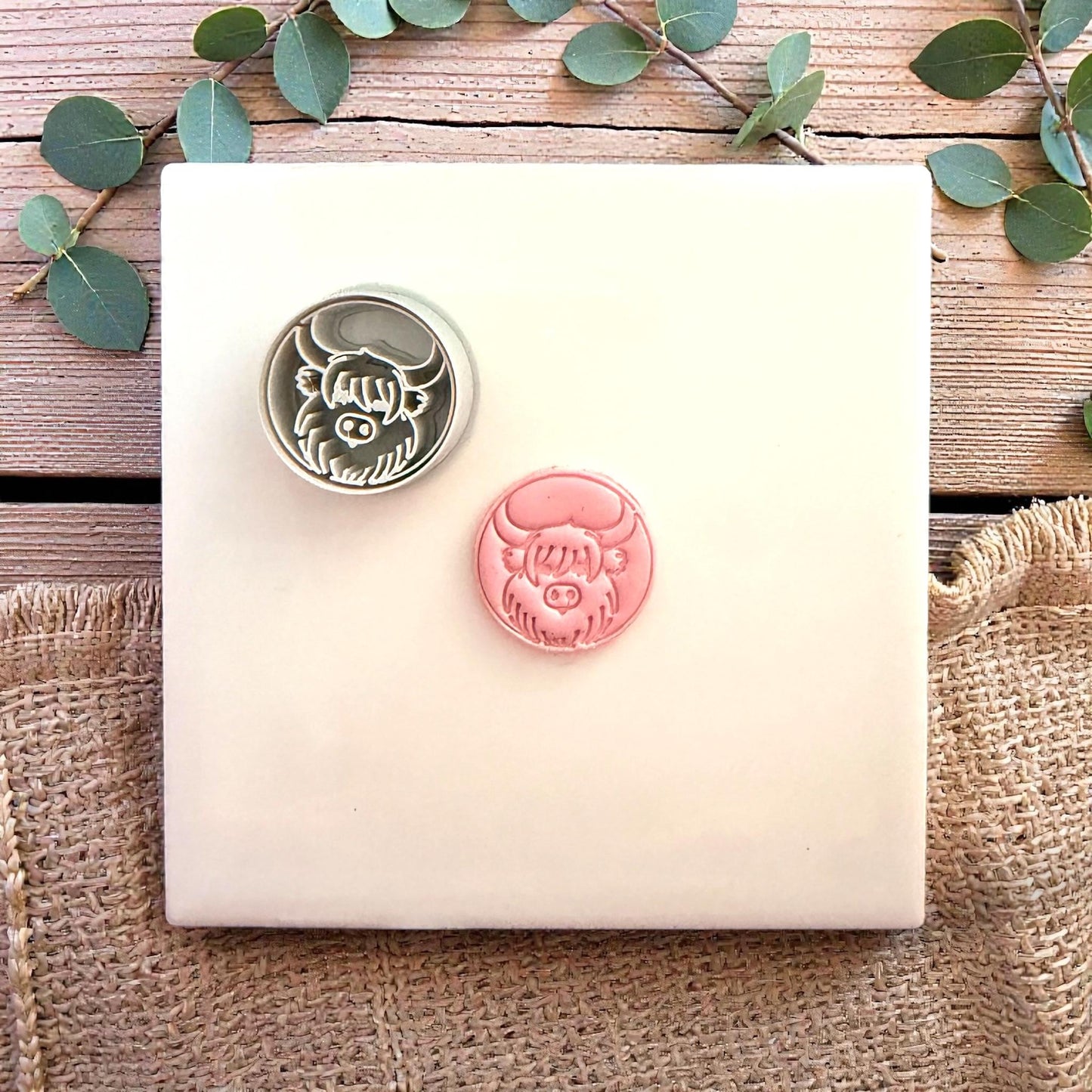 clay cutter and cow stamp side by side