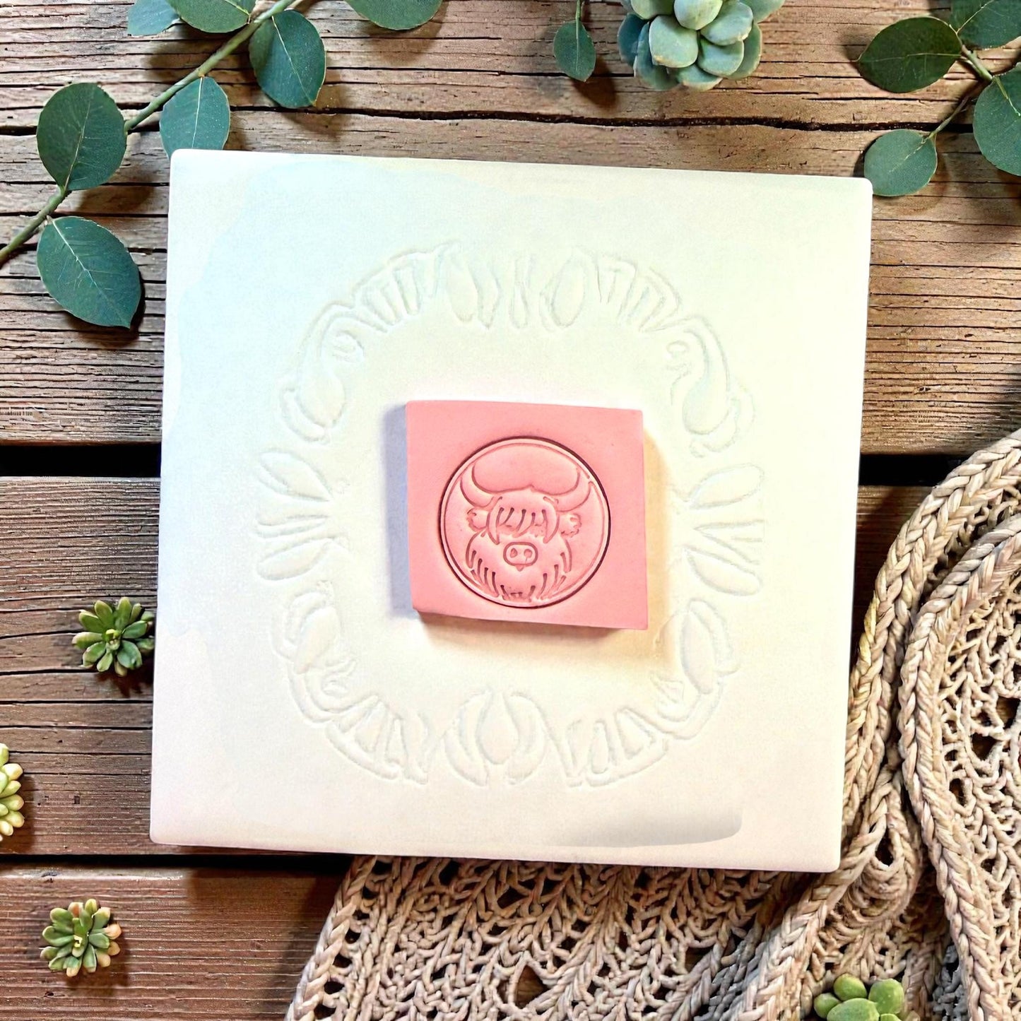 round highland cow cutter on display board