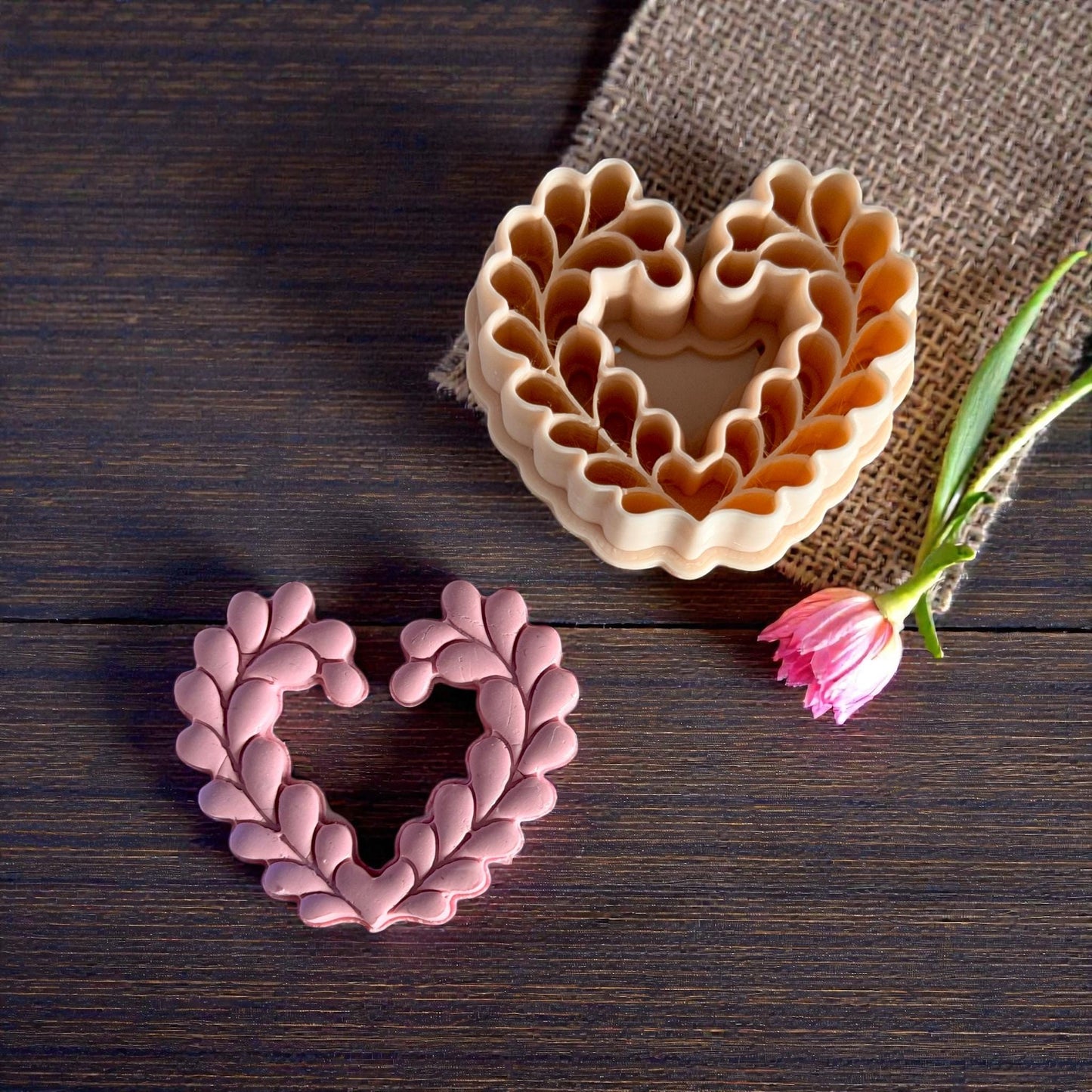 heart wreath clay piece next to matching cutter set