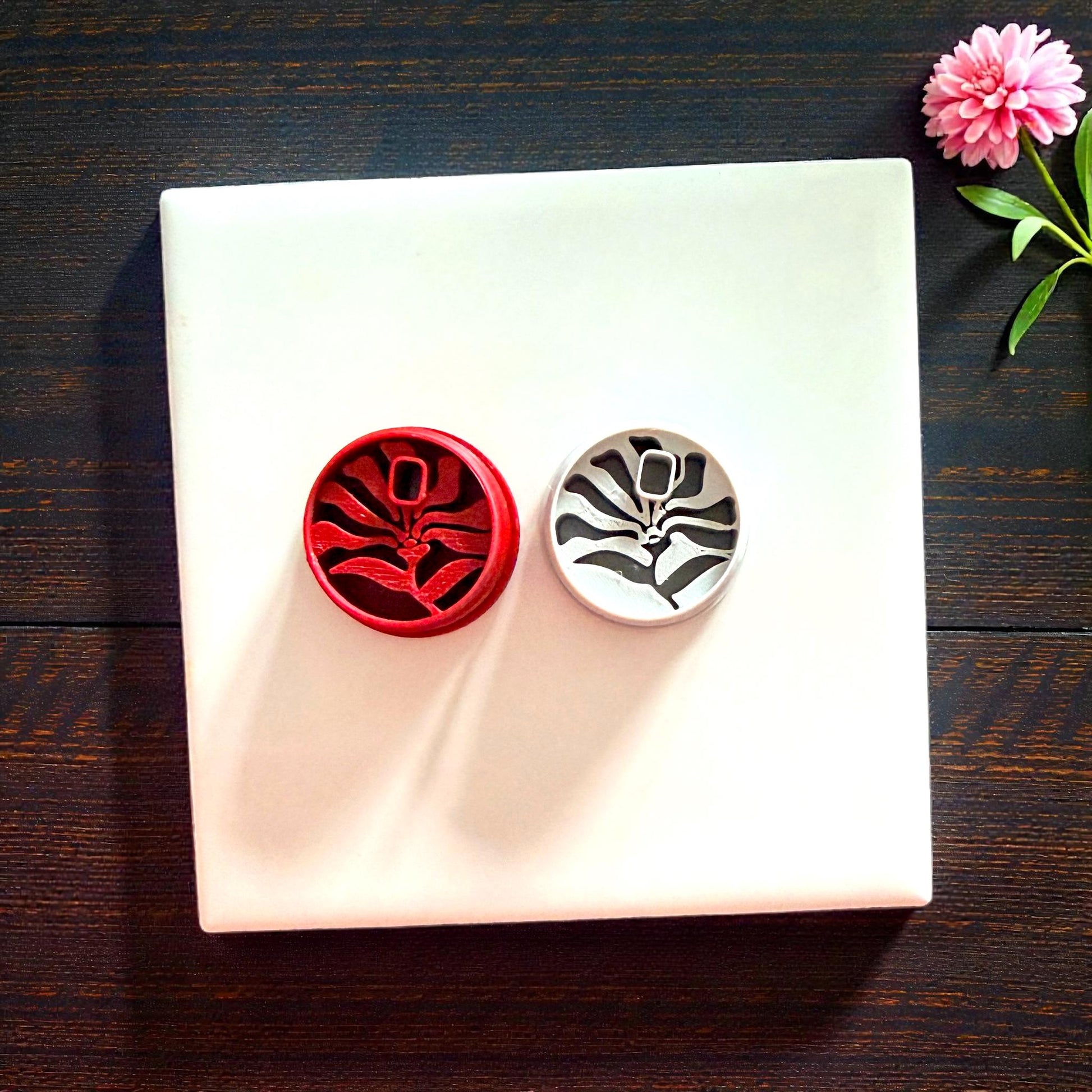 red and pink matisse flower cutters displayed together