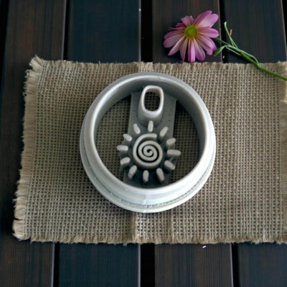 Round charm cutter close-up on burlap