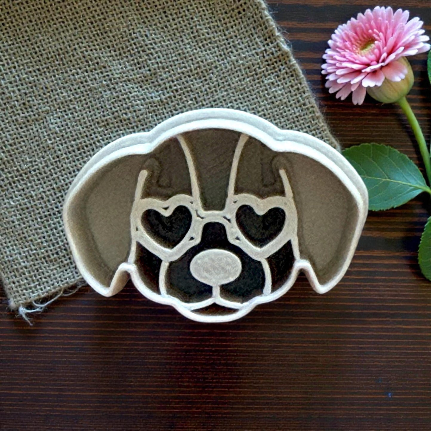 closeup puppy clay cutter on burlap