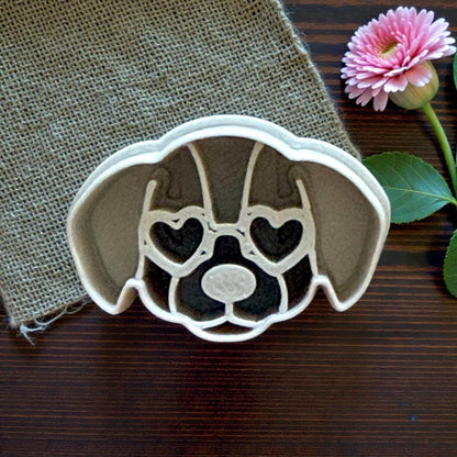 closeup puppy clay cutter on burlap