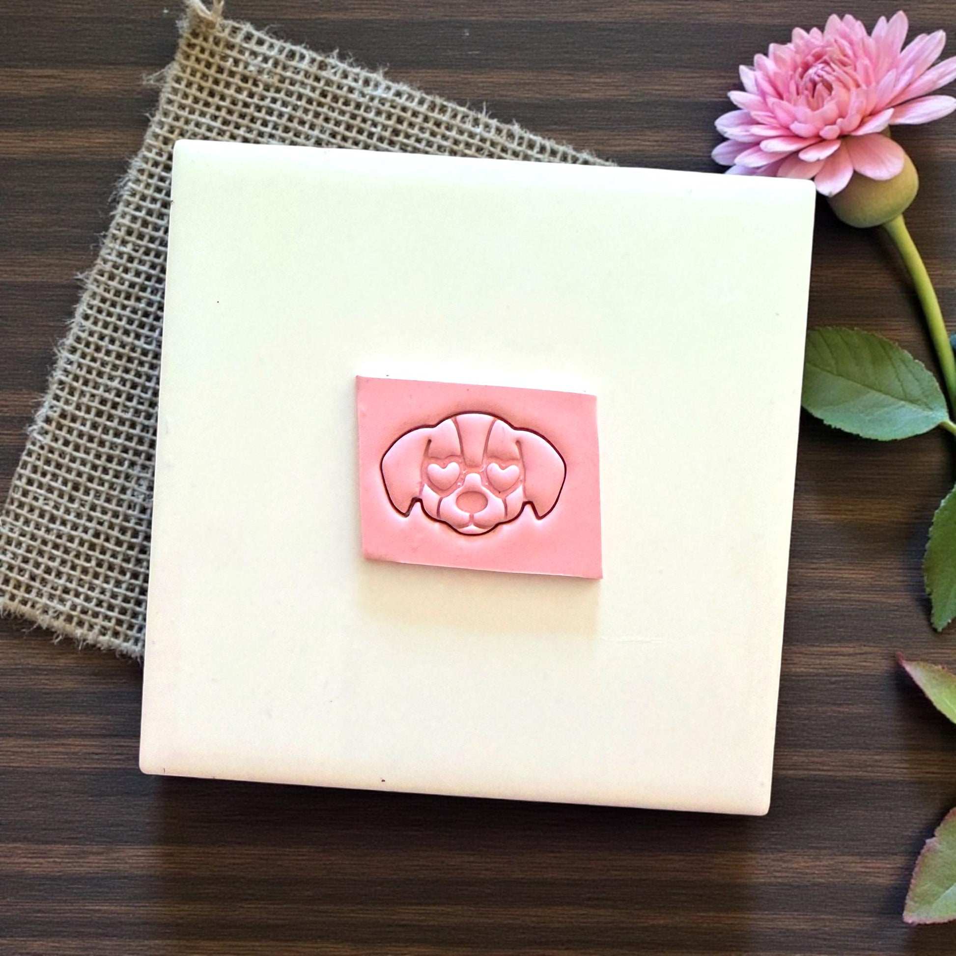heart eyes puppy clay impression on pink slab