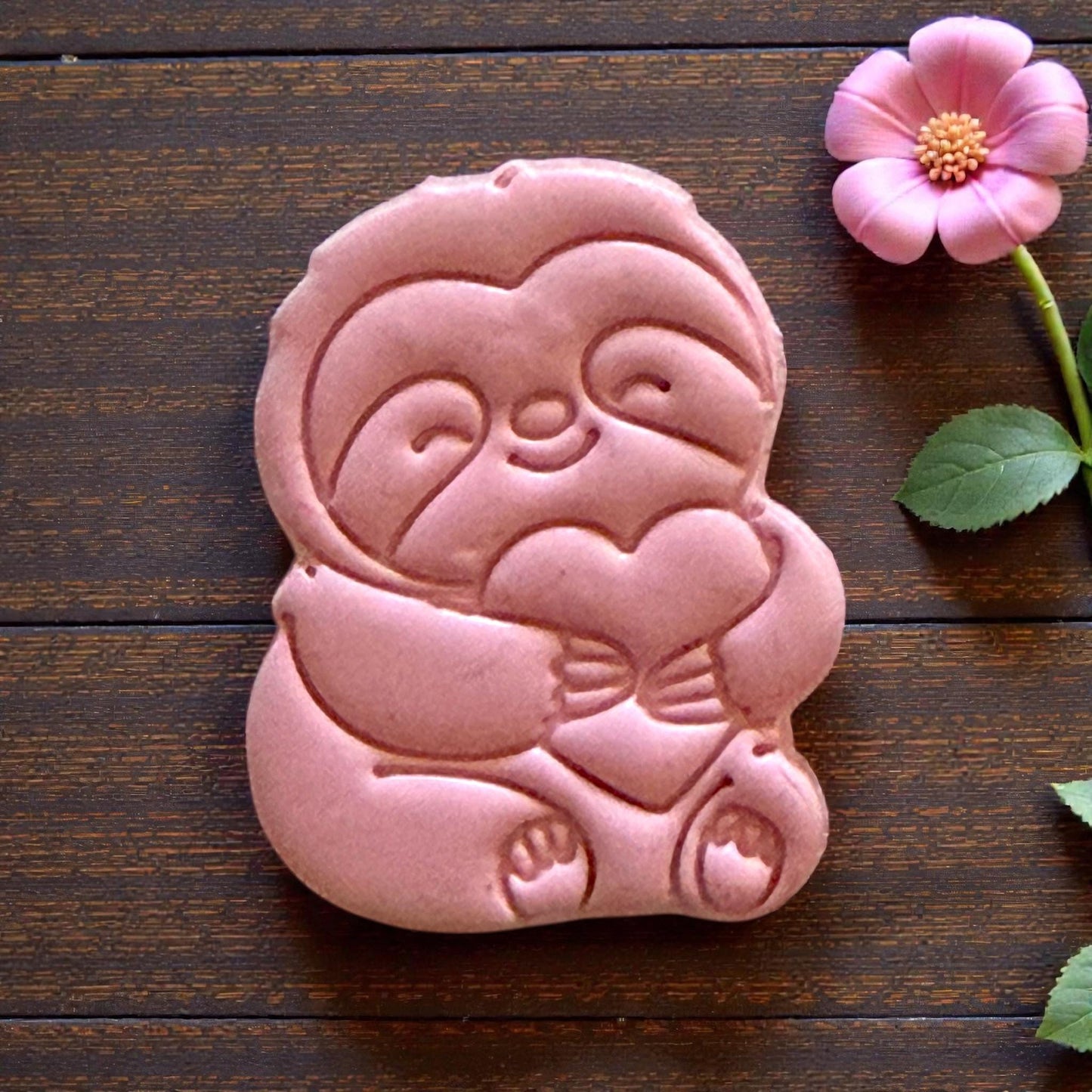 large sloth clay impression close up on burlap