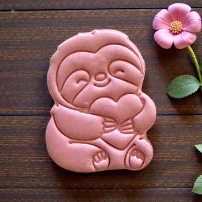large sloth clay impression close up on burlap