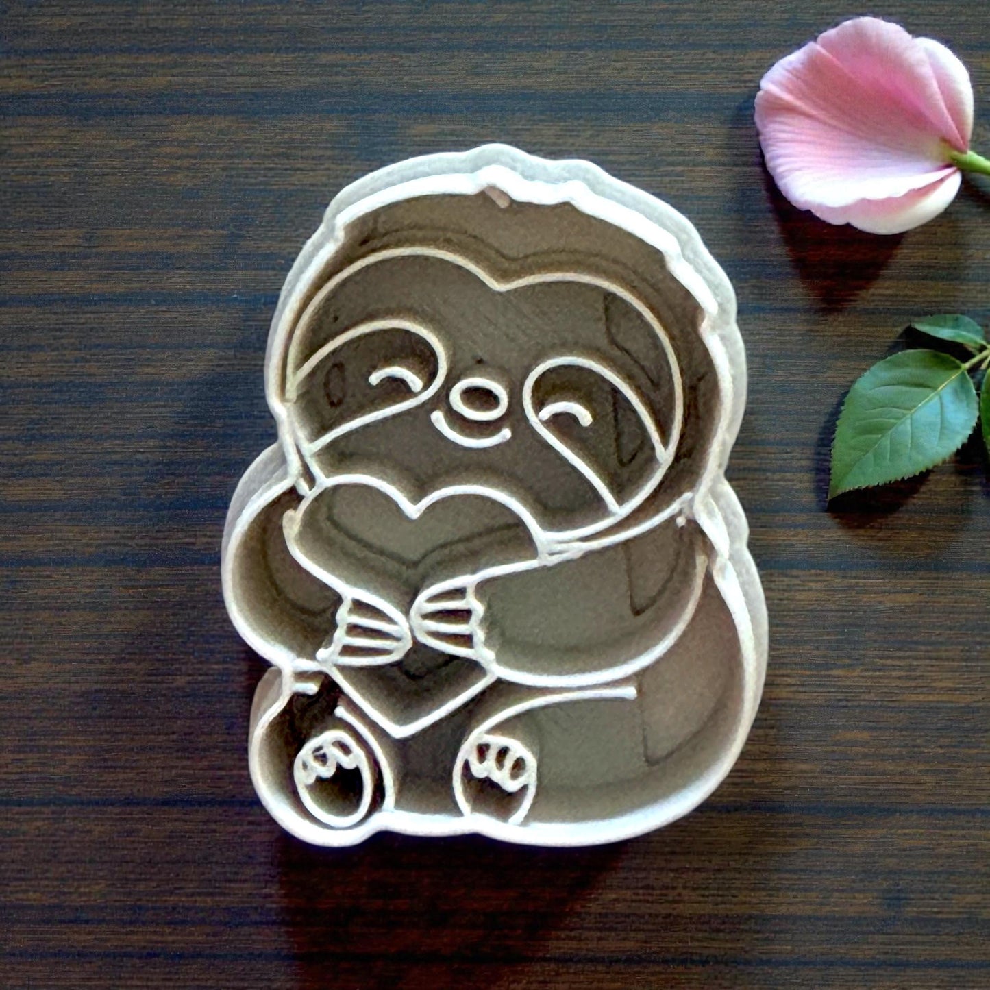 large sloth cutter detailed view on wood surface