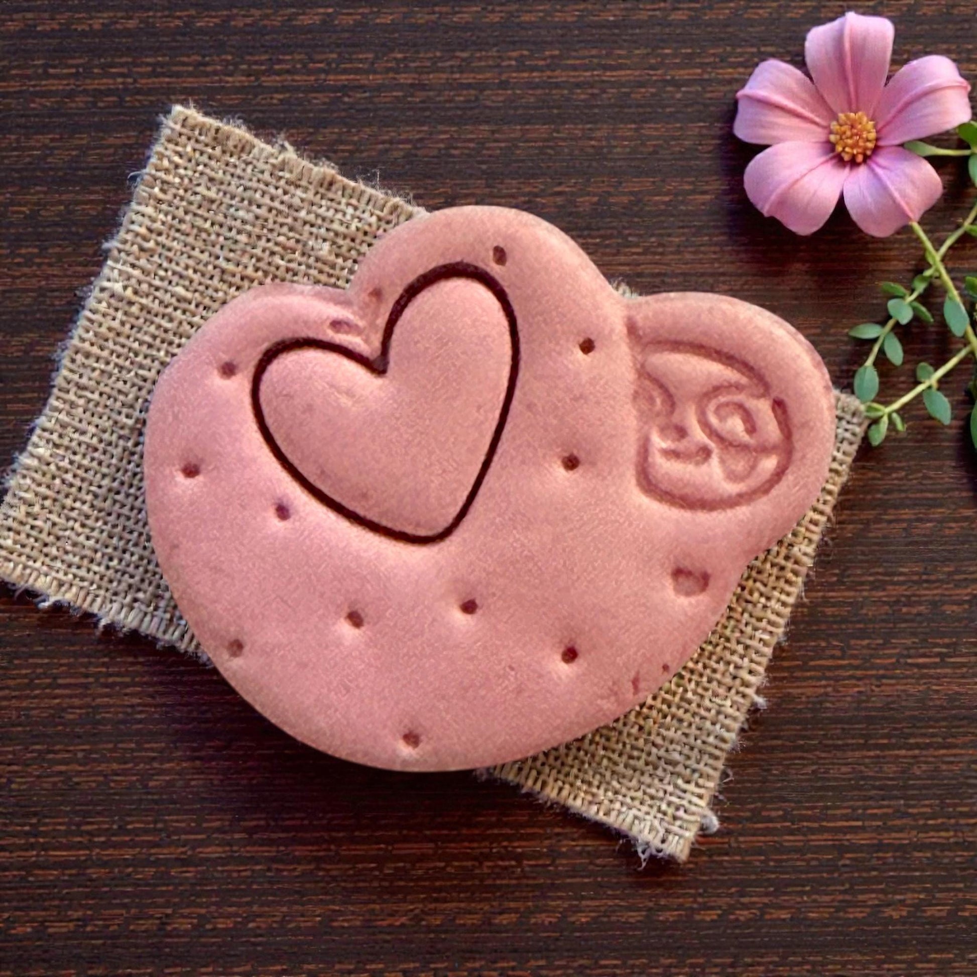 Close-up of sloth heart clay shape with dotted texture