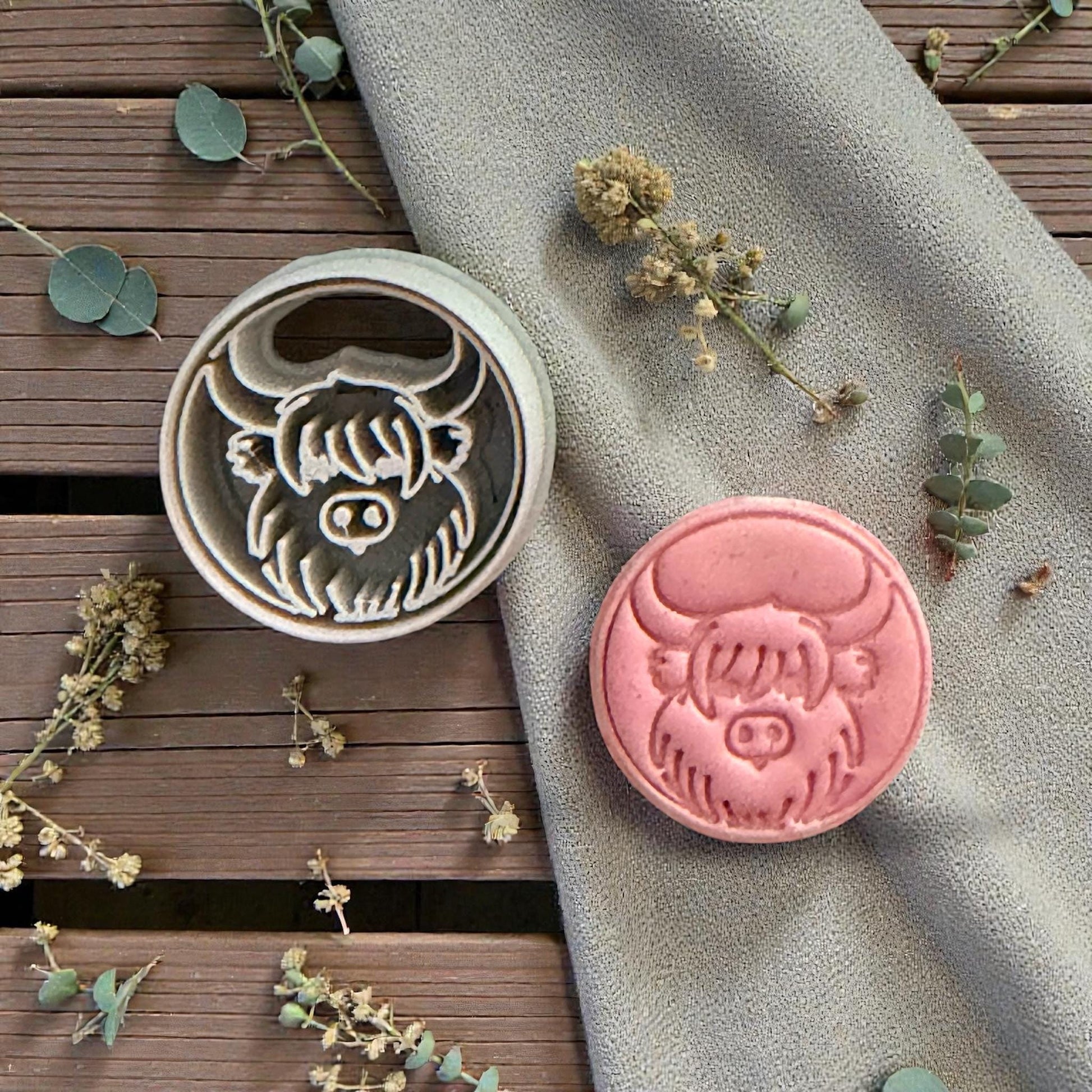 clay cutter and cow stamp side by side