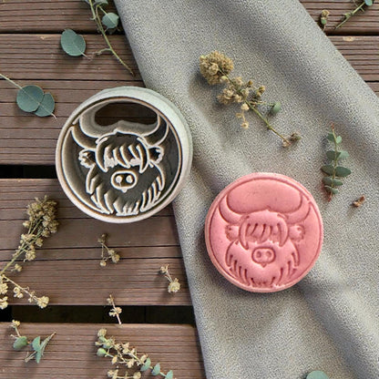 clay cutter and cow stamp side by side