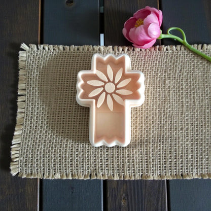 peach floral cross cutter on burlap mat