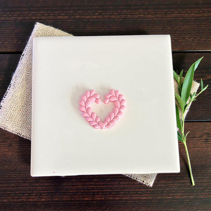 small heart wreath clay shape on white tile