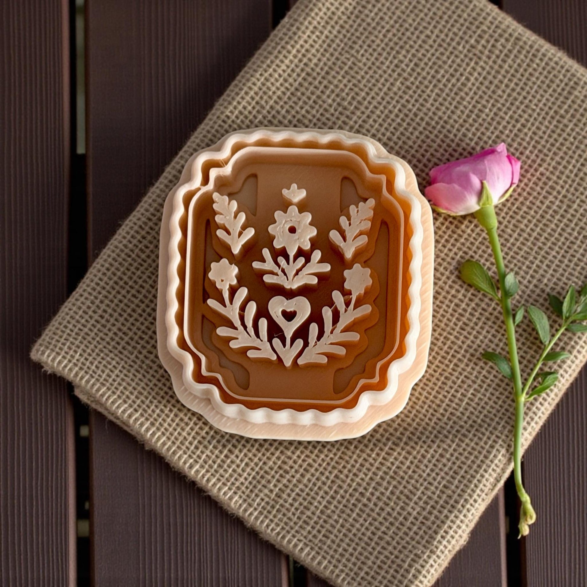 large nested plaque cutter set styled on burlap with pink flower