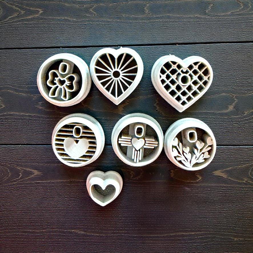 grey polymer clay cutter collection - bow, sunburst hear, lattice heart, striped heart, zia heart, branches heart