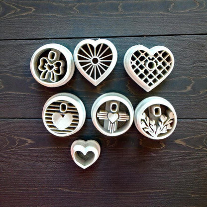 grey polymer clay cutter collection - bow, sunburst hear, lattice heart, striped heart, zia heart, branches heart
