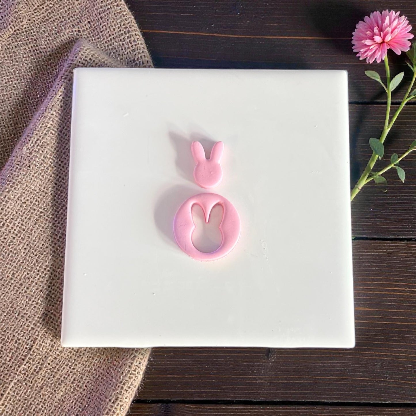 bunny clay cutouts with outer ring on white tile