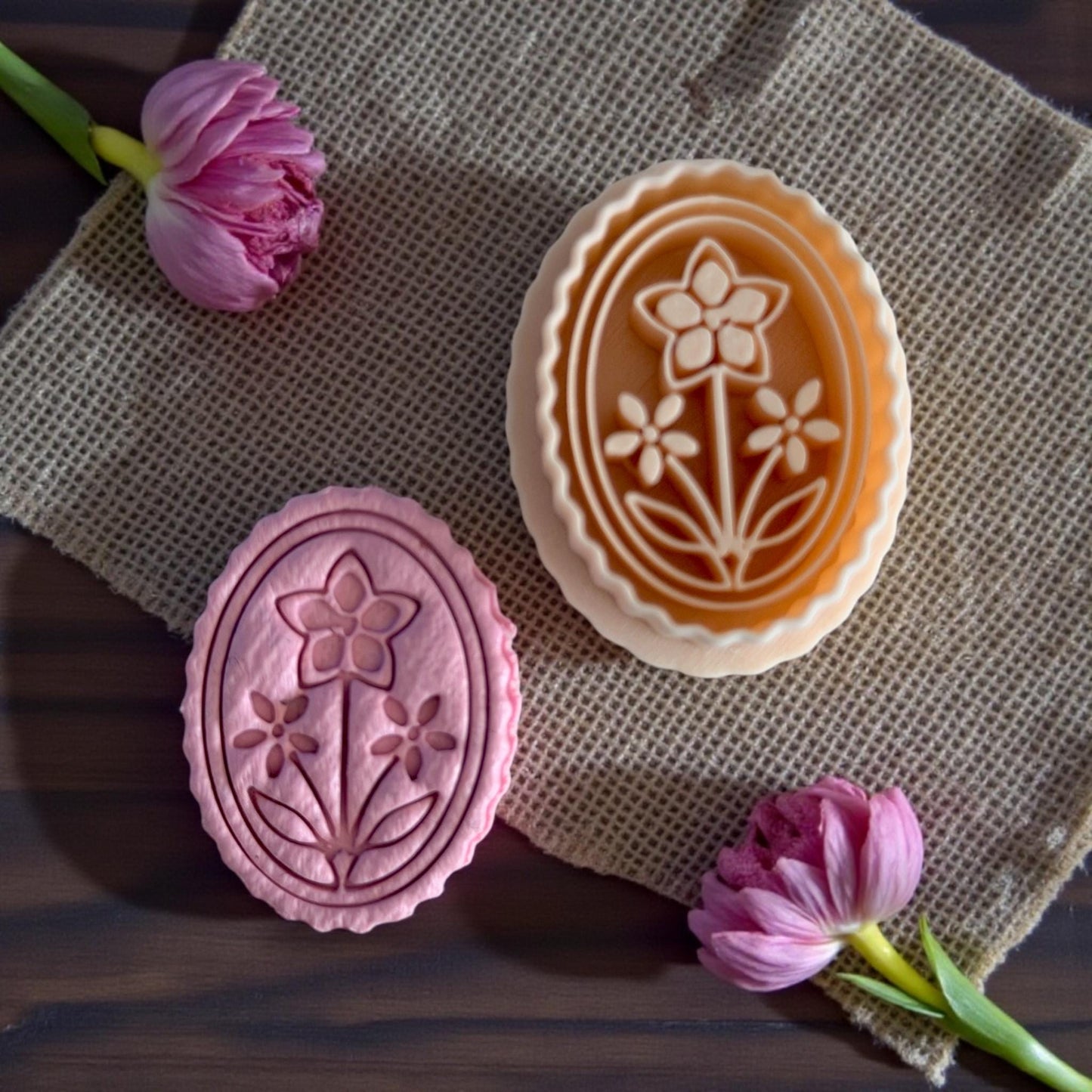 pink and tan floral cameo cutters shown together