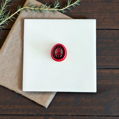 small red floral oval cutter centered on tile