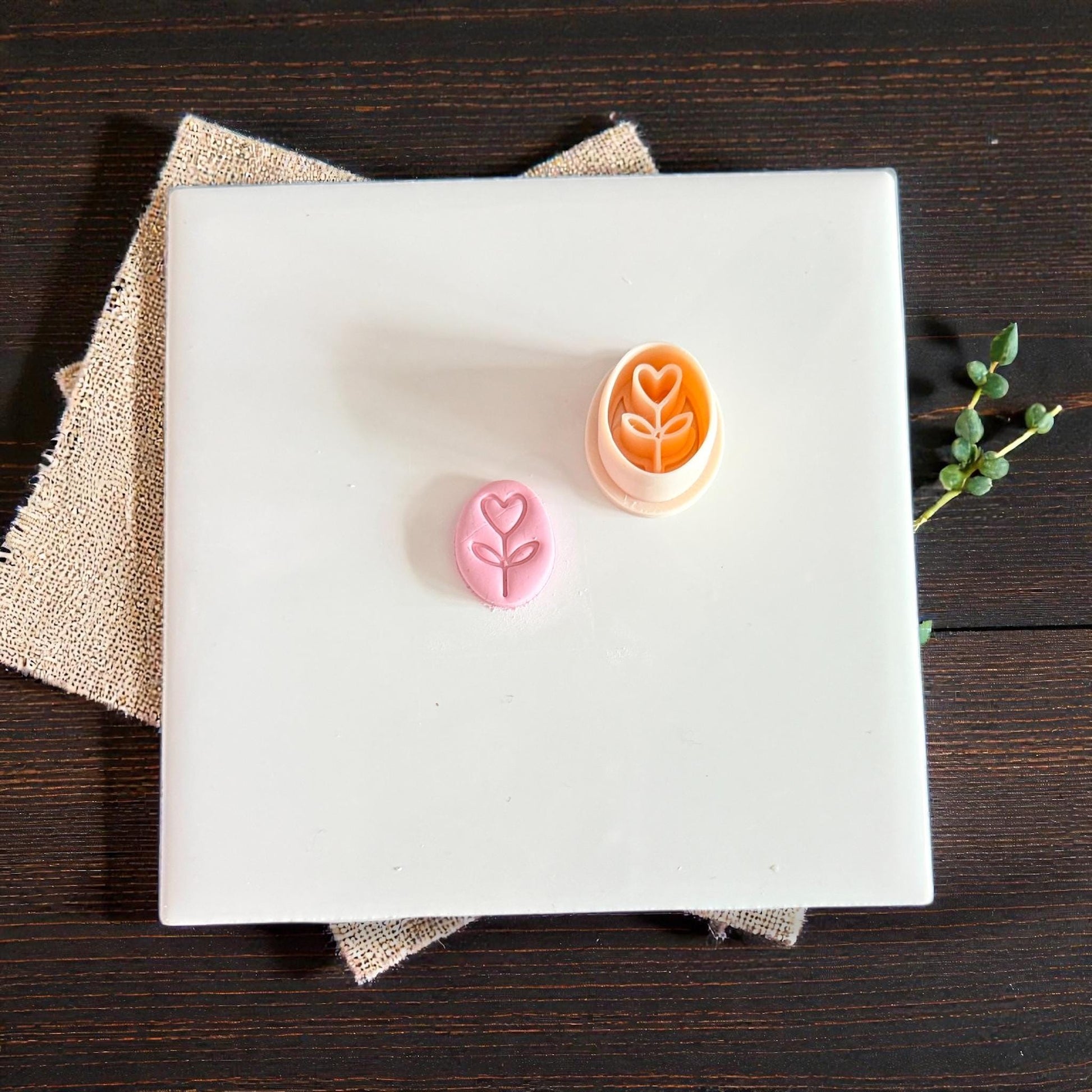 pink and orange heart stem cutters shown together on tile
