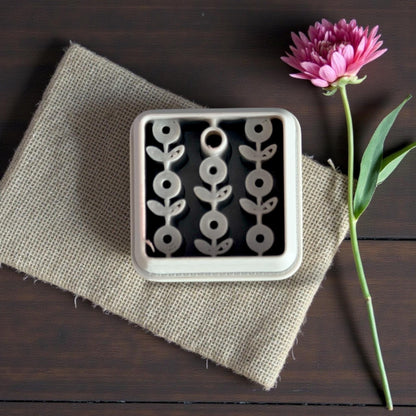 floral clay cutter on burlap with flower