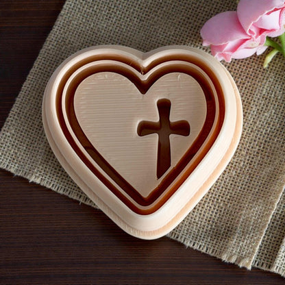 close up beige heart cross cutter on burlap