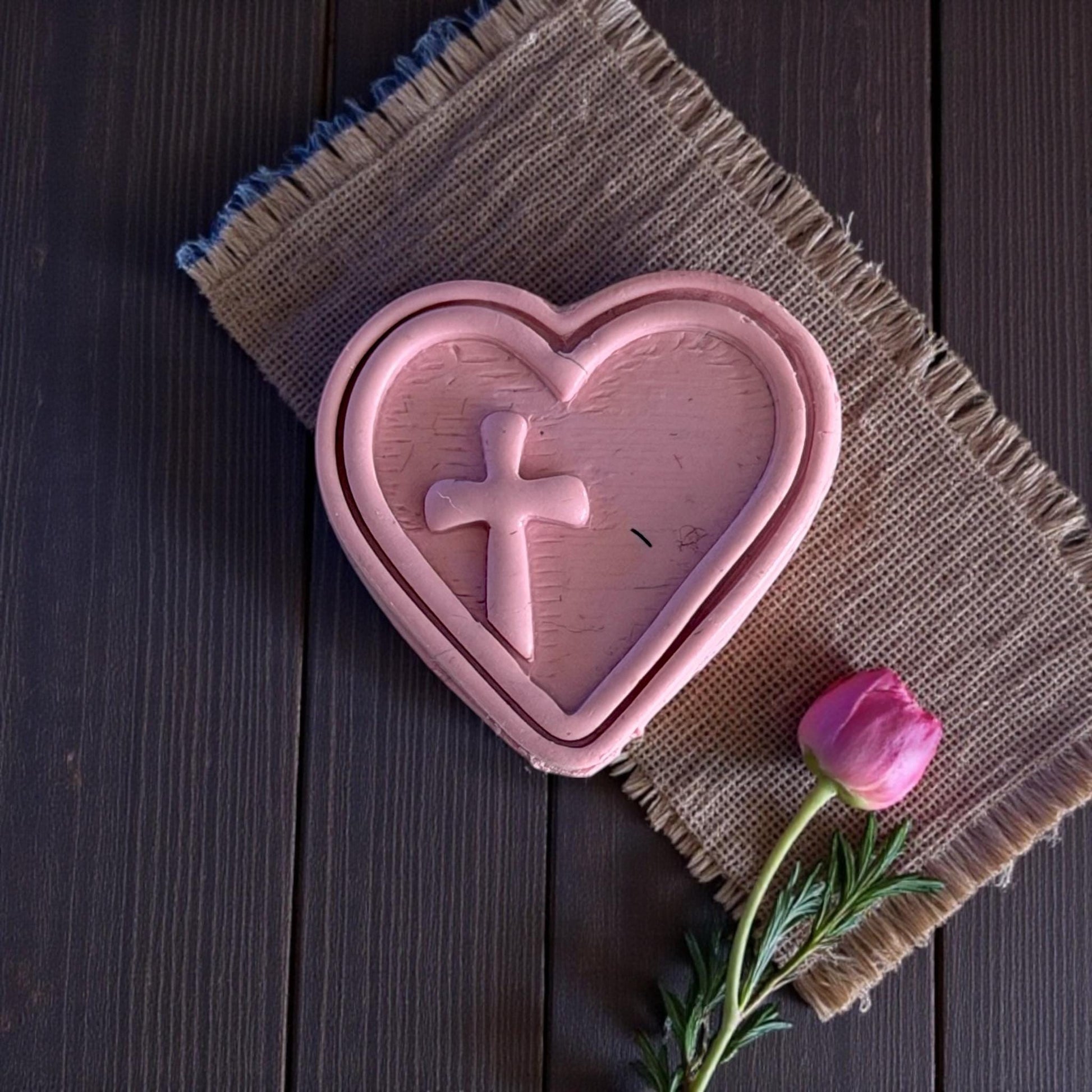 large heart cross clay imprint on burlap mat