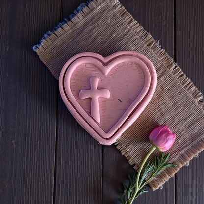 large heart cross clay imprint on burlap mat
