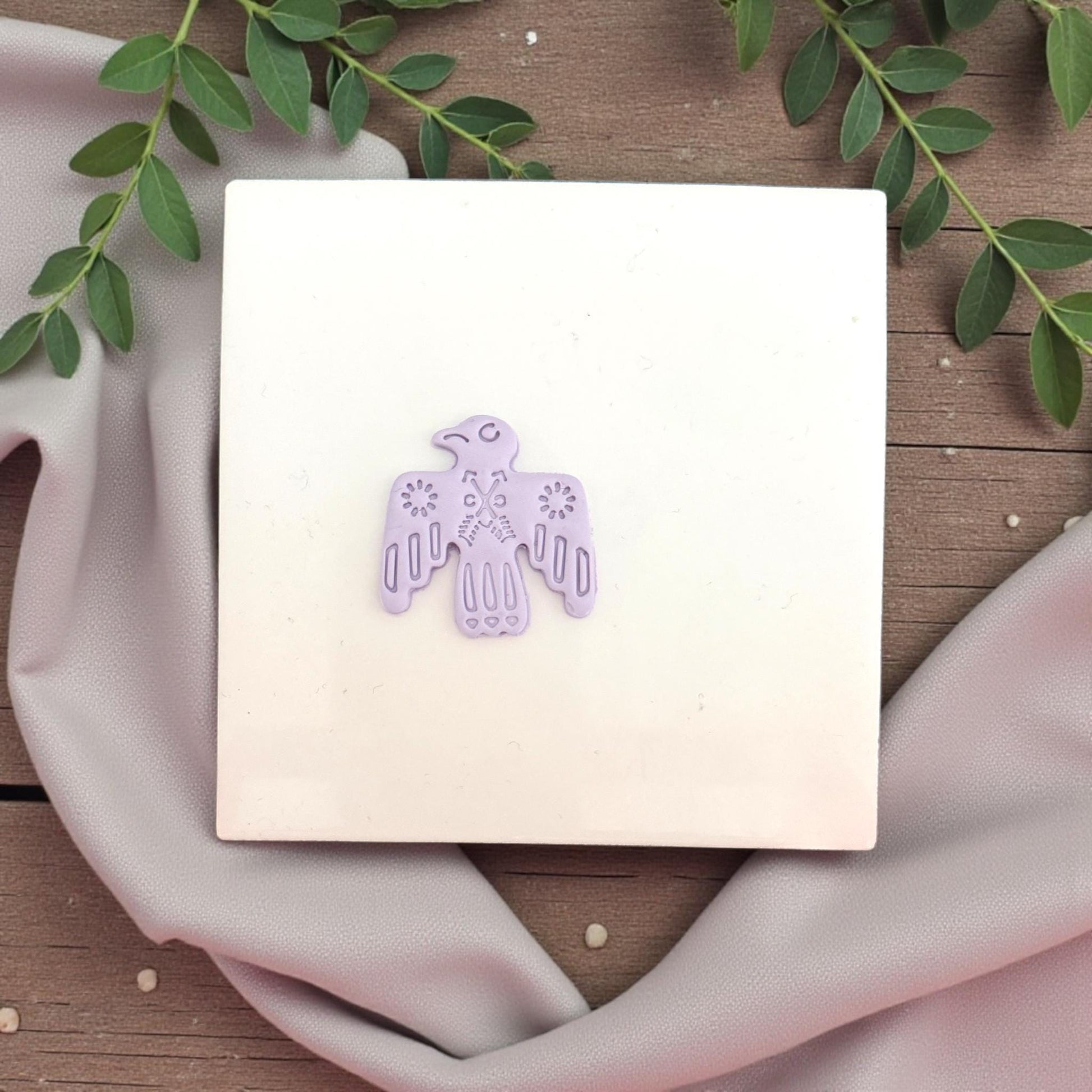lavender bird clay imprint on tile