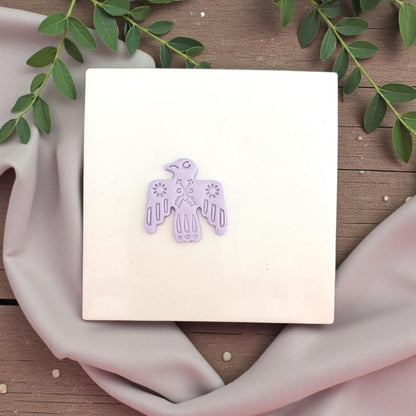 lavender bird clay imprint on tile
