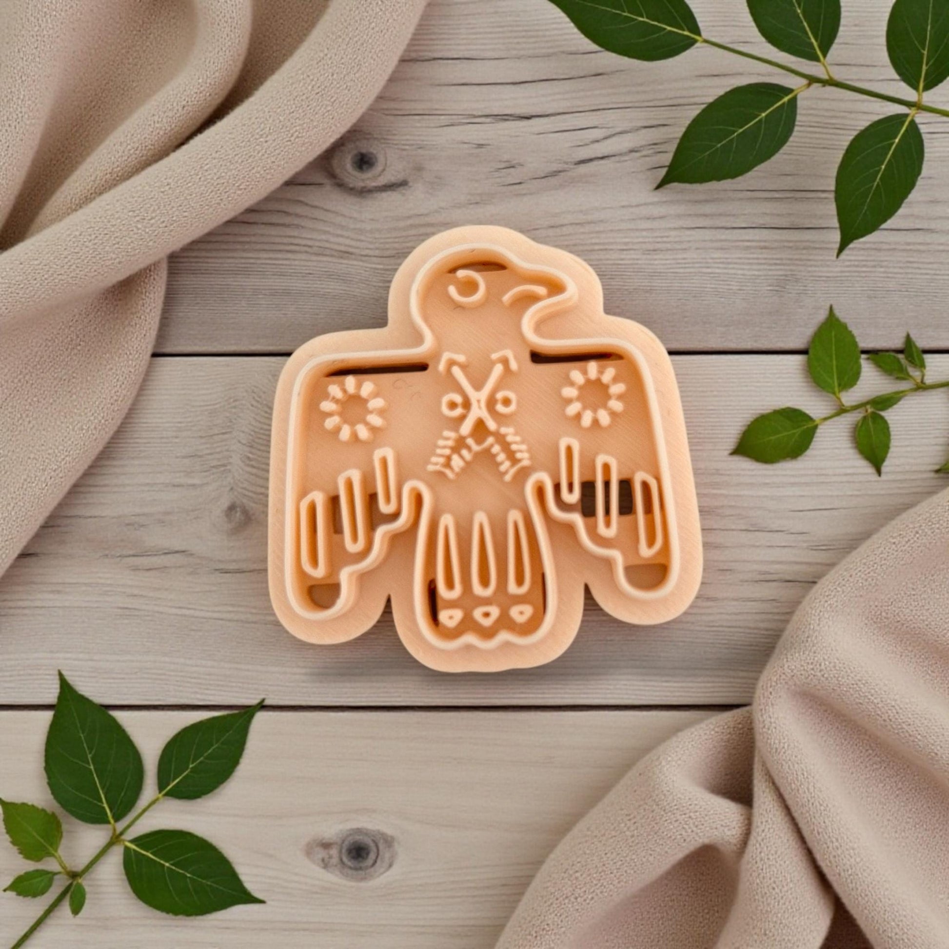 folk bird clay cutter on wood background