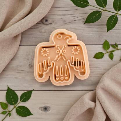folk bird clay cutter on wood background