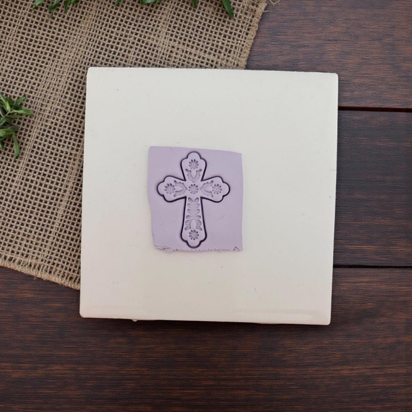 floral cross clay impression on tile