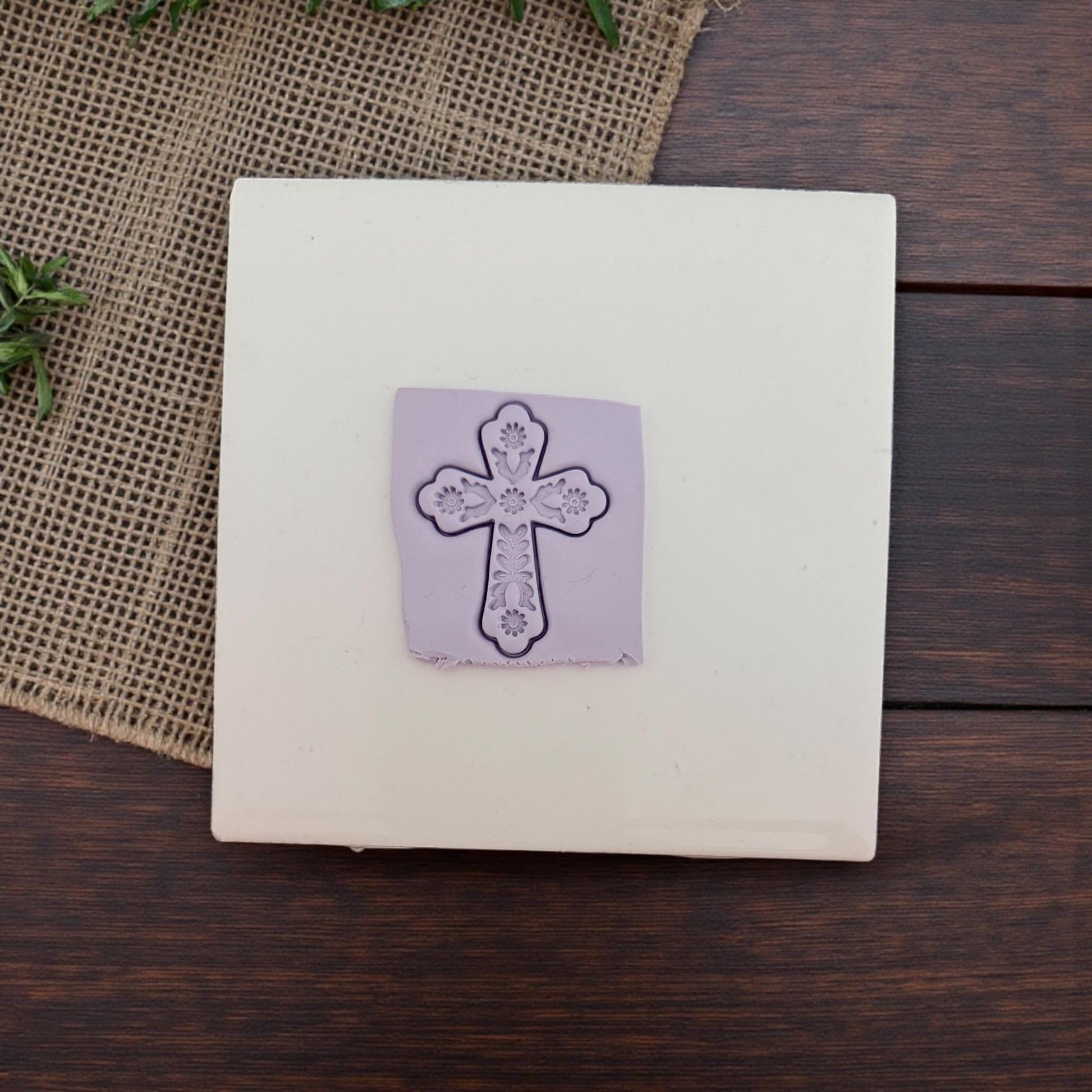 floral cross clay impression on tile