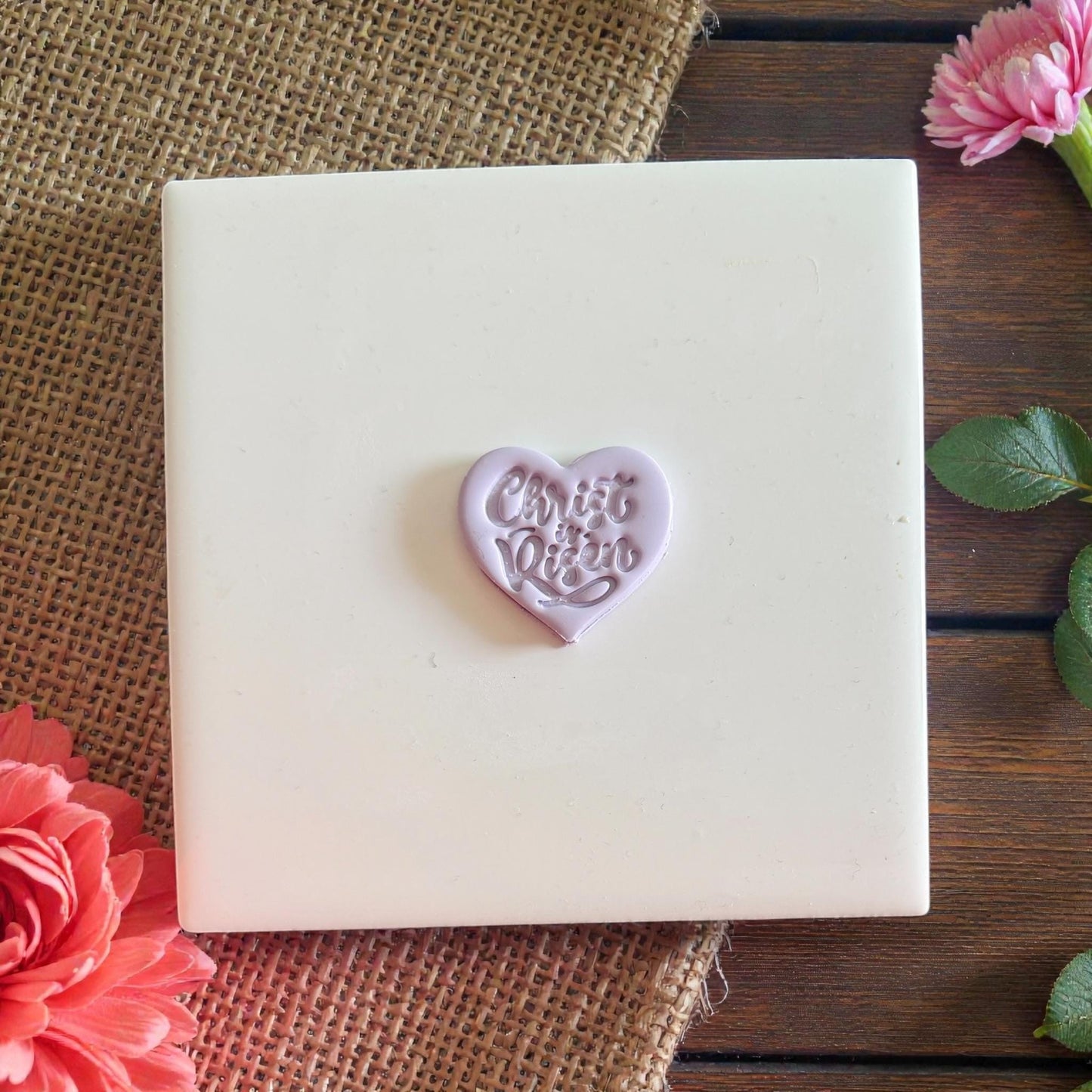 Small purple heart clay impression centered on tile