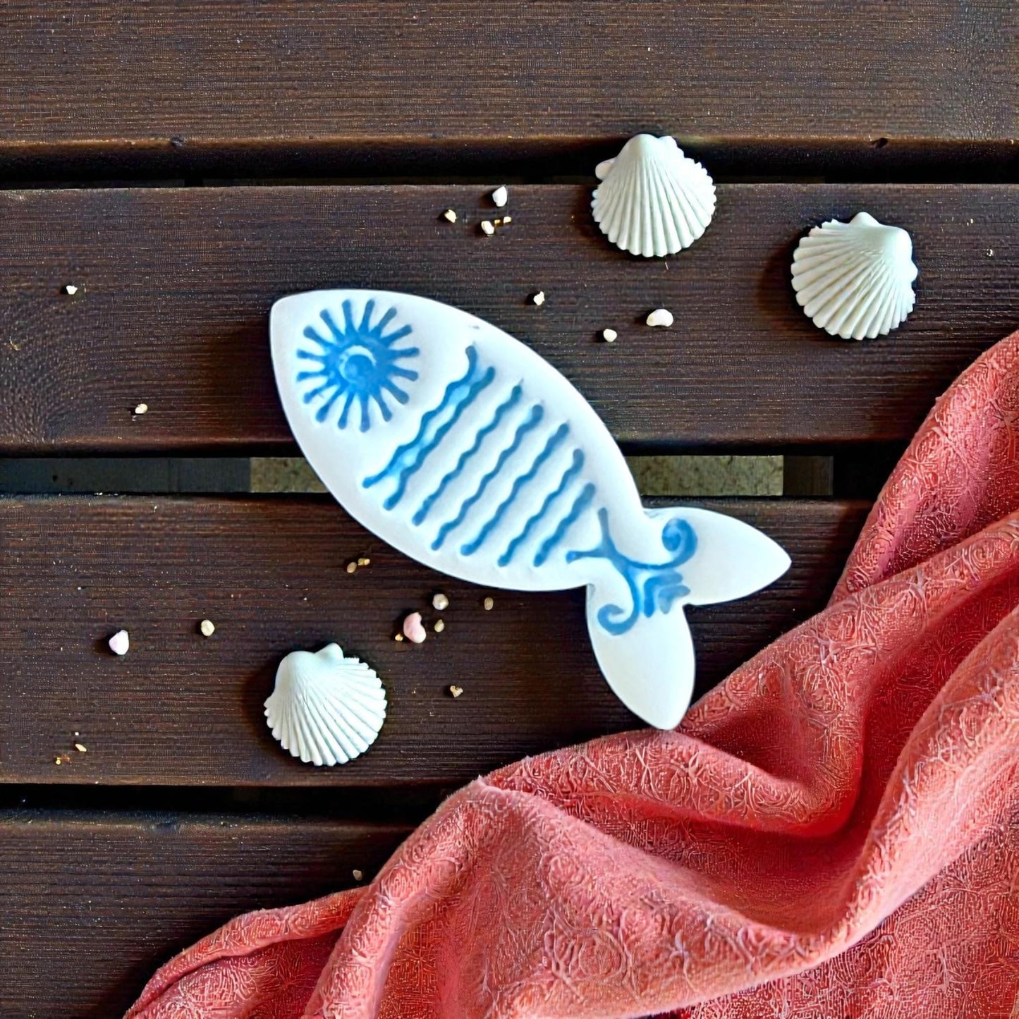 blue sun fish clay imprint with shells and coral fabric
