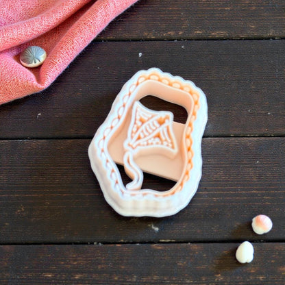 manta ray cutter set with scalloped outline on wooden table