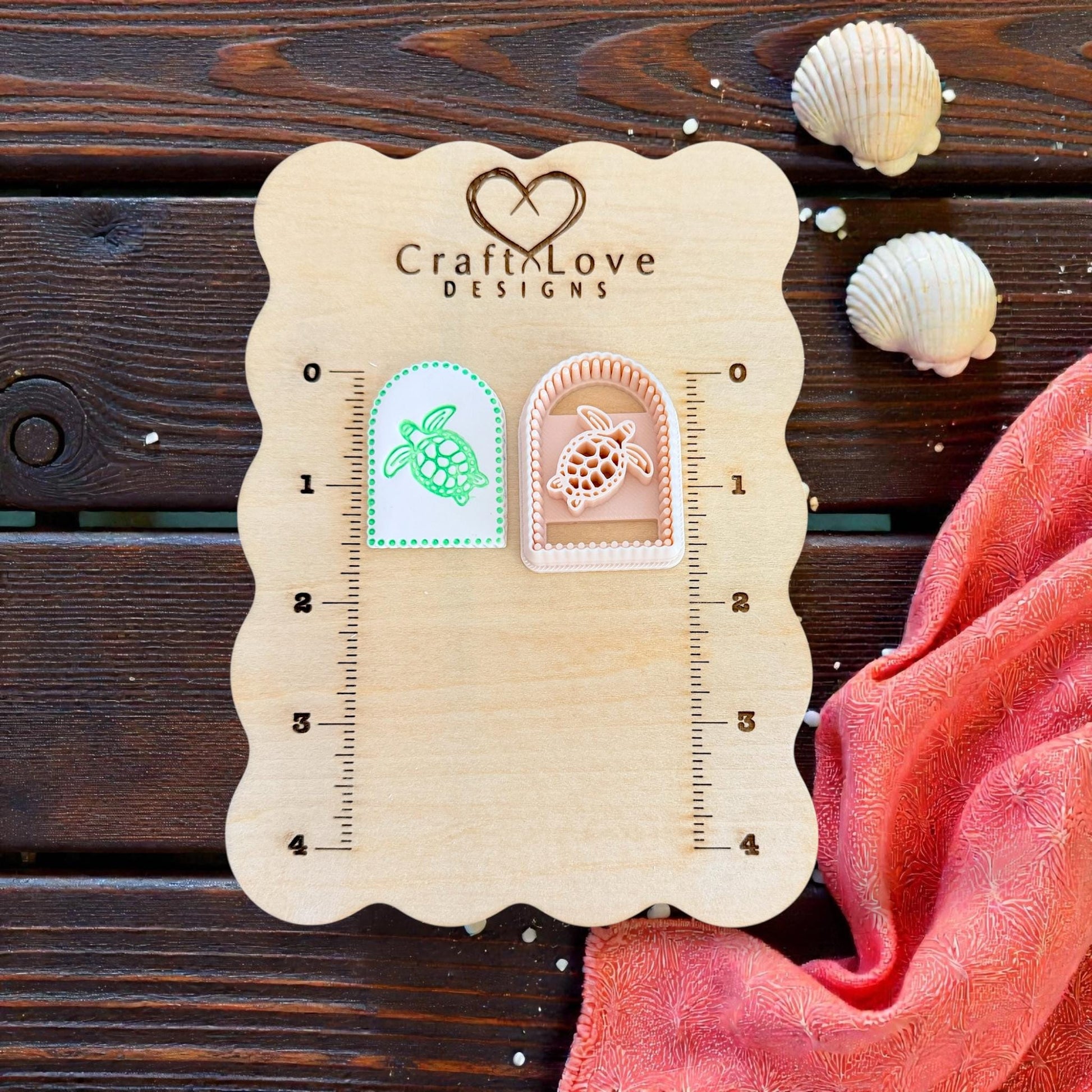 two arched turtle imprints on measuring board