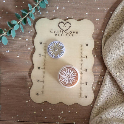 two daisy cutters on sizing board
