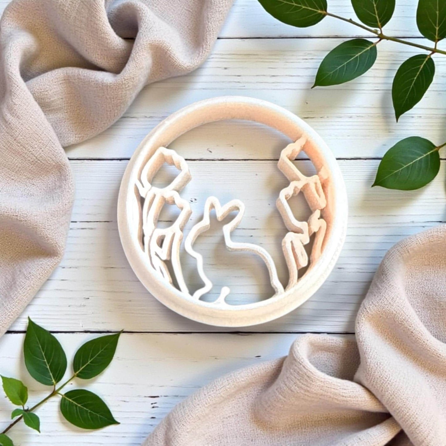 bunny in bloom polymer clay cutter on white wood