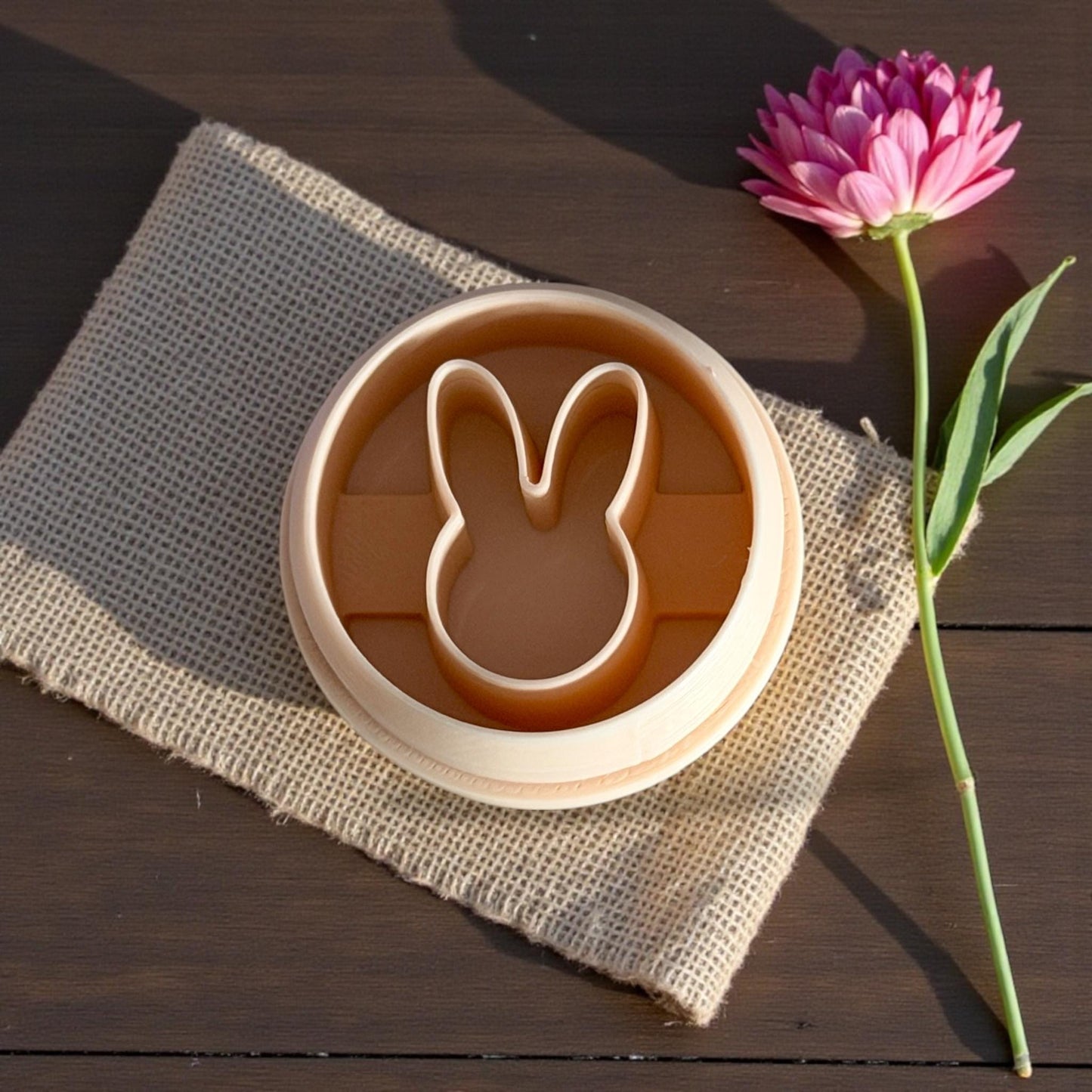 bunny cutter on burlap with pink flower