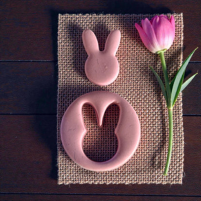 bunny clay cutouts on burlap with pink flower