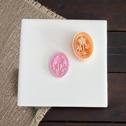 floral cameo cutouts displayed on white tile