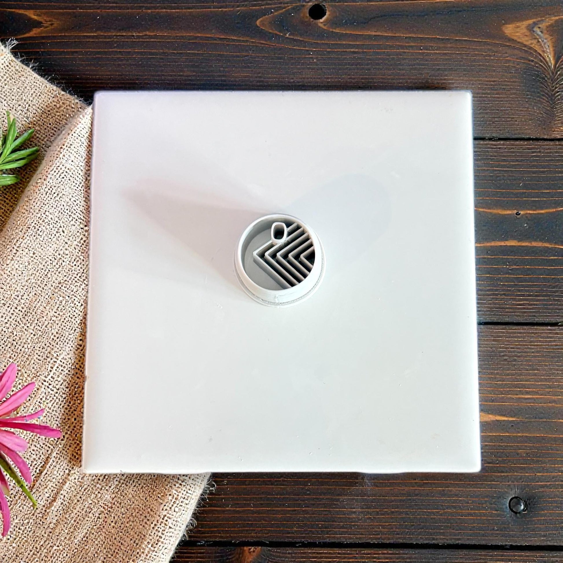 circle cutter centered on white tile