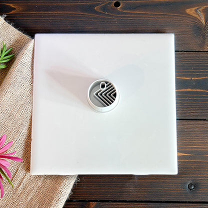 circle cutter centered on white tile