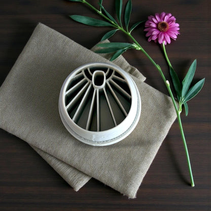 Gray sunburst cutter on linen fabric