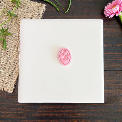 small pink oval heart charm clay impression