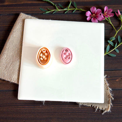 oval heart charm cutters in two sizes on white tile