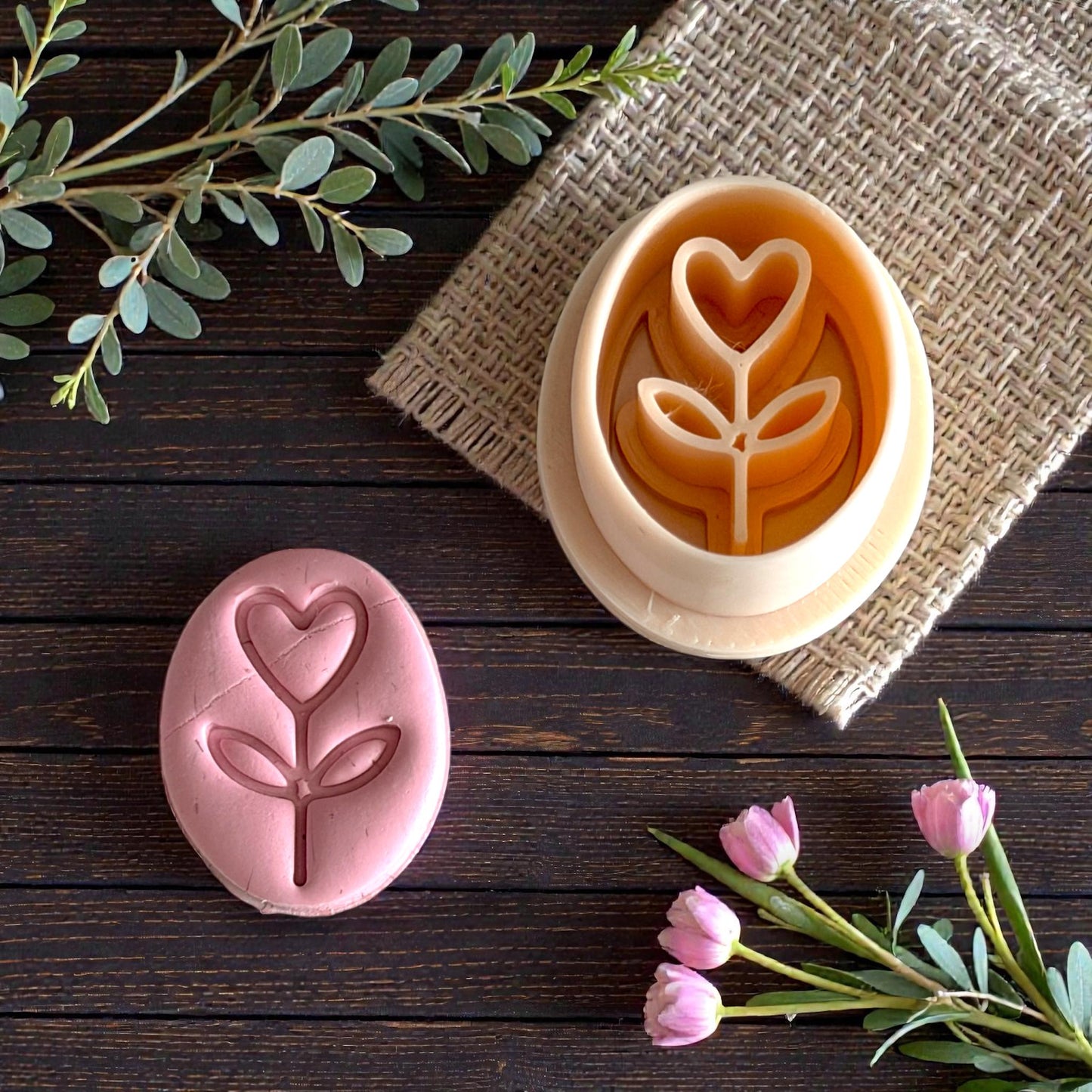 heart flower cutter and clay imprint displayed with florals