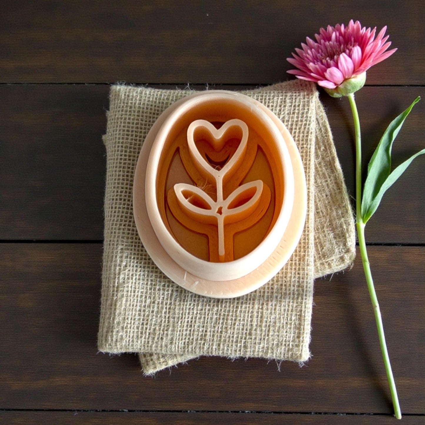 heart stem imprint on burlap with pink flower