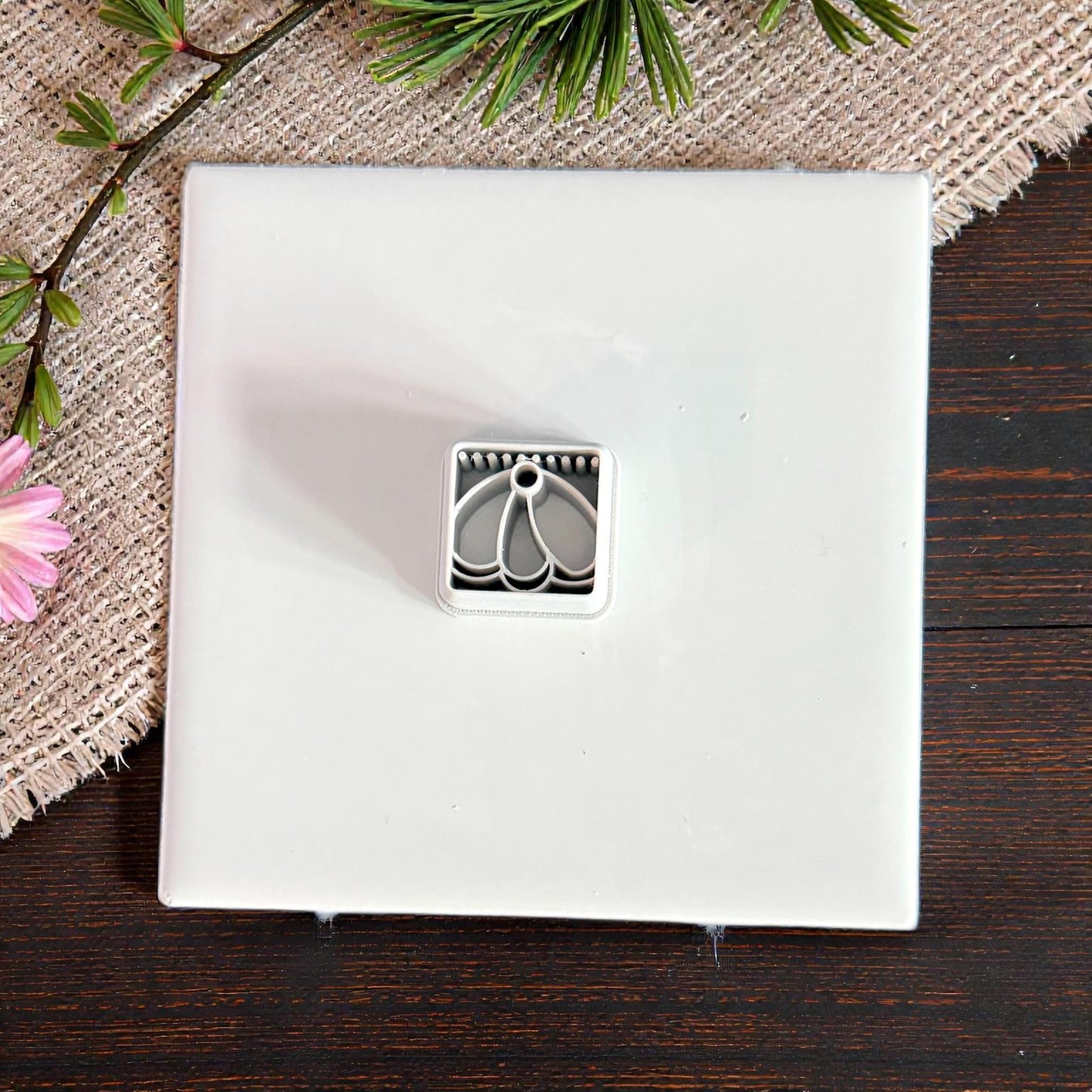 small cutter displayed on white tile